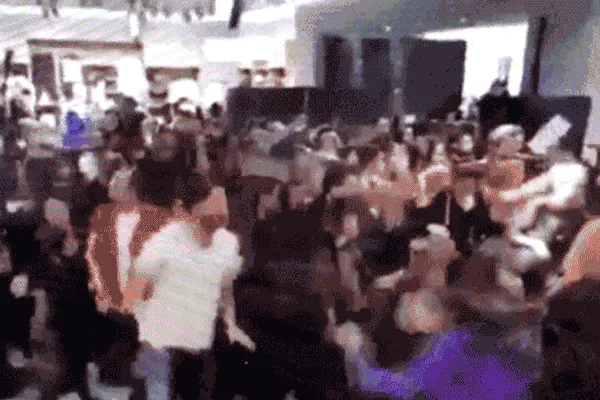 Shoppers rushing an H&M store at the Balmain launch