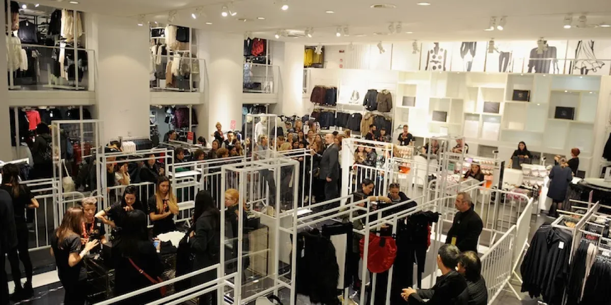 Shoppers emptying an H&M store in Florence during the launch