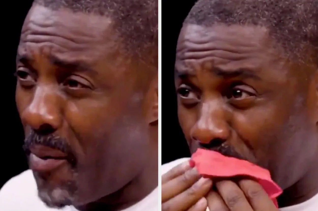 Idris Elba reacting to a hot wing, a widely shared meme.