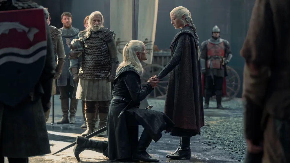 Courtiers kneeling in a scene from House of the Dragon.