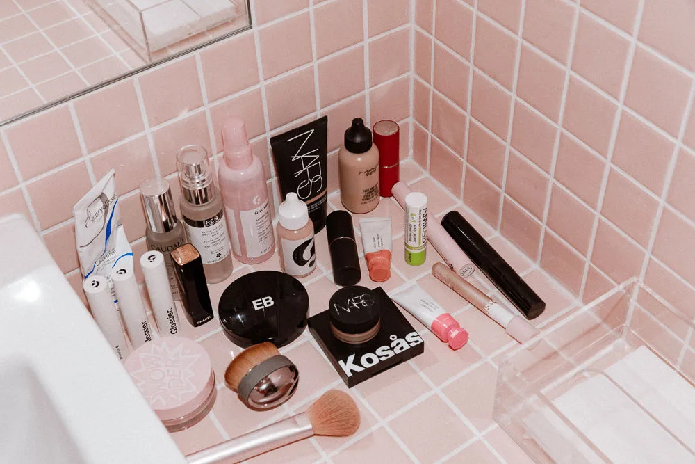 Beauty products on a bathroom shelf