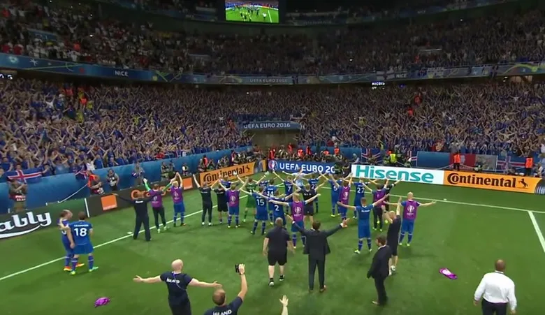 Iceland's players lead the thunderclap with their fans at Euro 2016
