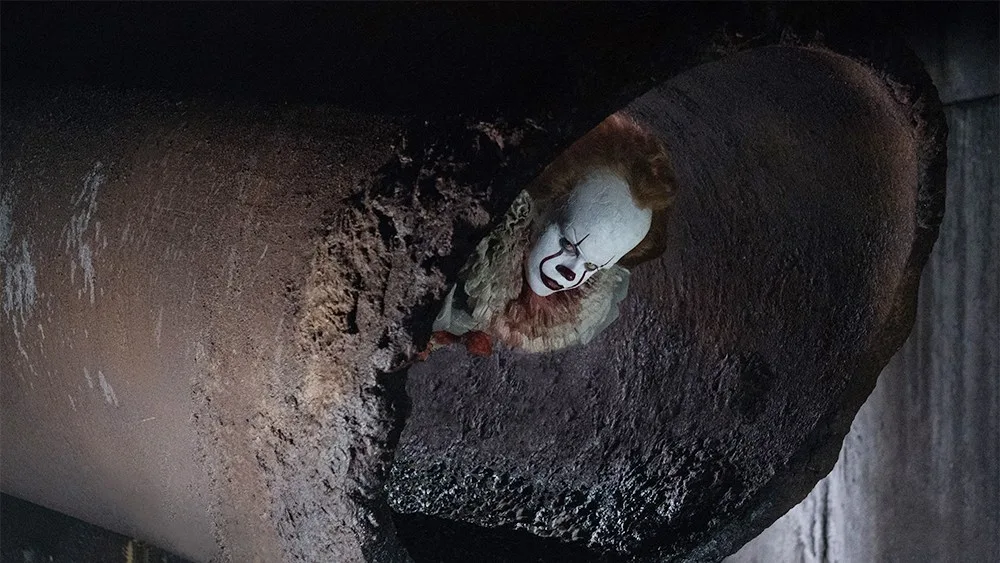 Pennywise in the storm drain.