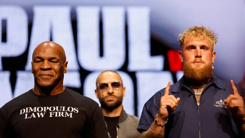 NEW YORK, NEW YORK - MAY 13: (L-R) Mike Tyson and Jake Paul speak onstage at the press conference in promotion for the upcoming Jake Paul vs. Mike Tyson boxing match at The Apollo Theater on May 13,…