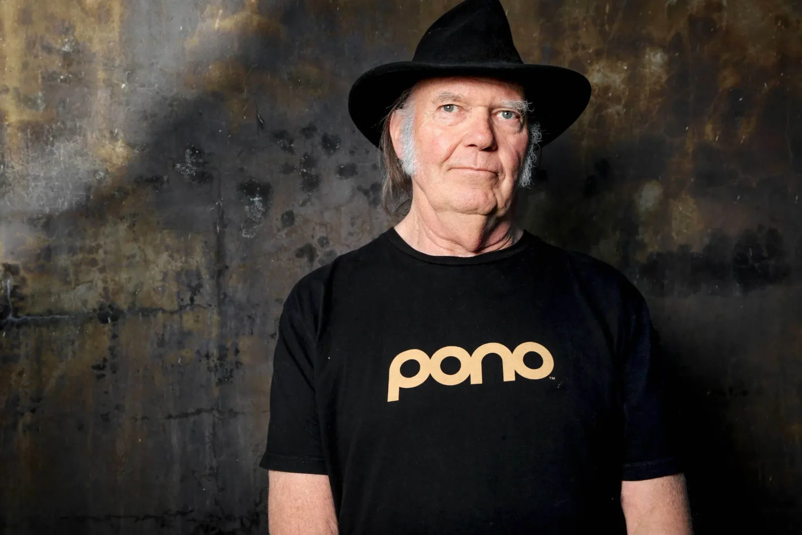 Neil Young, who pulled his music from Spotify over the podcast in 2022.