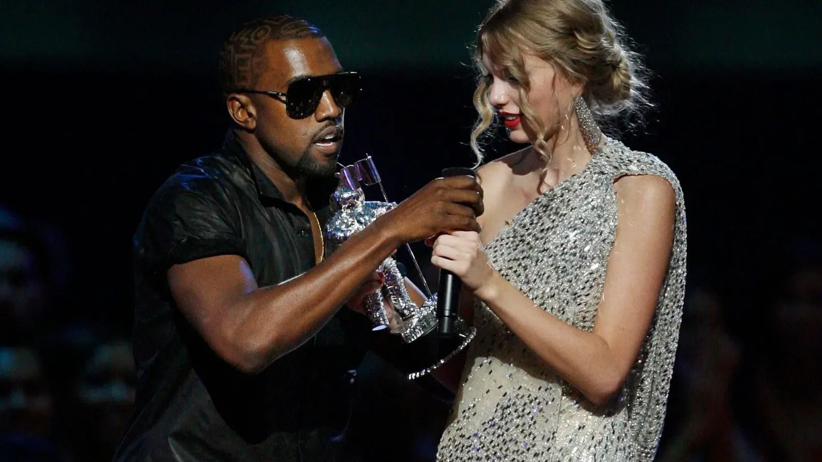 Kanye West, Taylor Swift. Singer Kanye West takes the microphone from singer Taylor Swift as she accepts the "Best Female Video" award during the MTV Video Music Awards on in New YorkMTV Video Music…