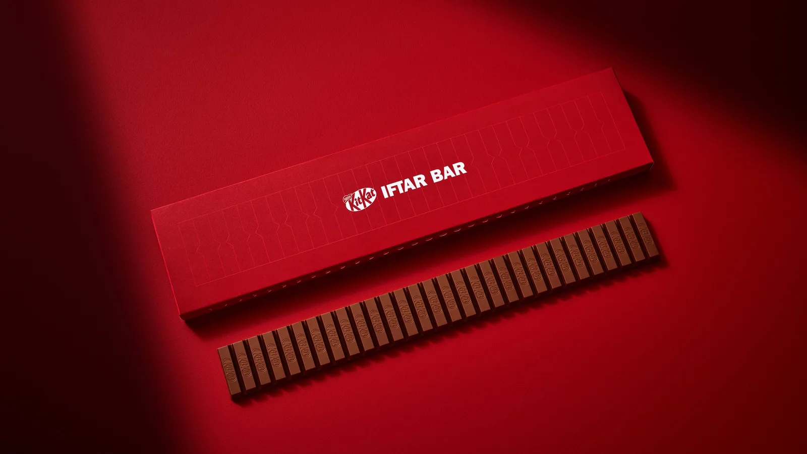 The Iftar Bar beside its red geometric packaging.