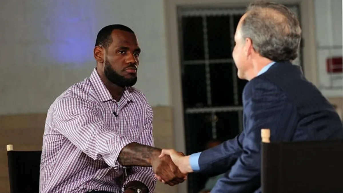 LeBron James and Jim Gray shake hands on The Decision set
