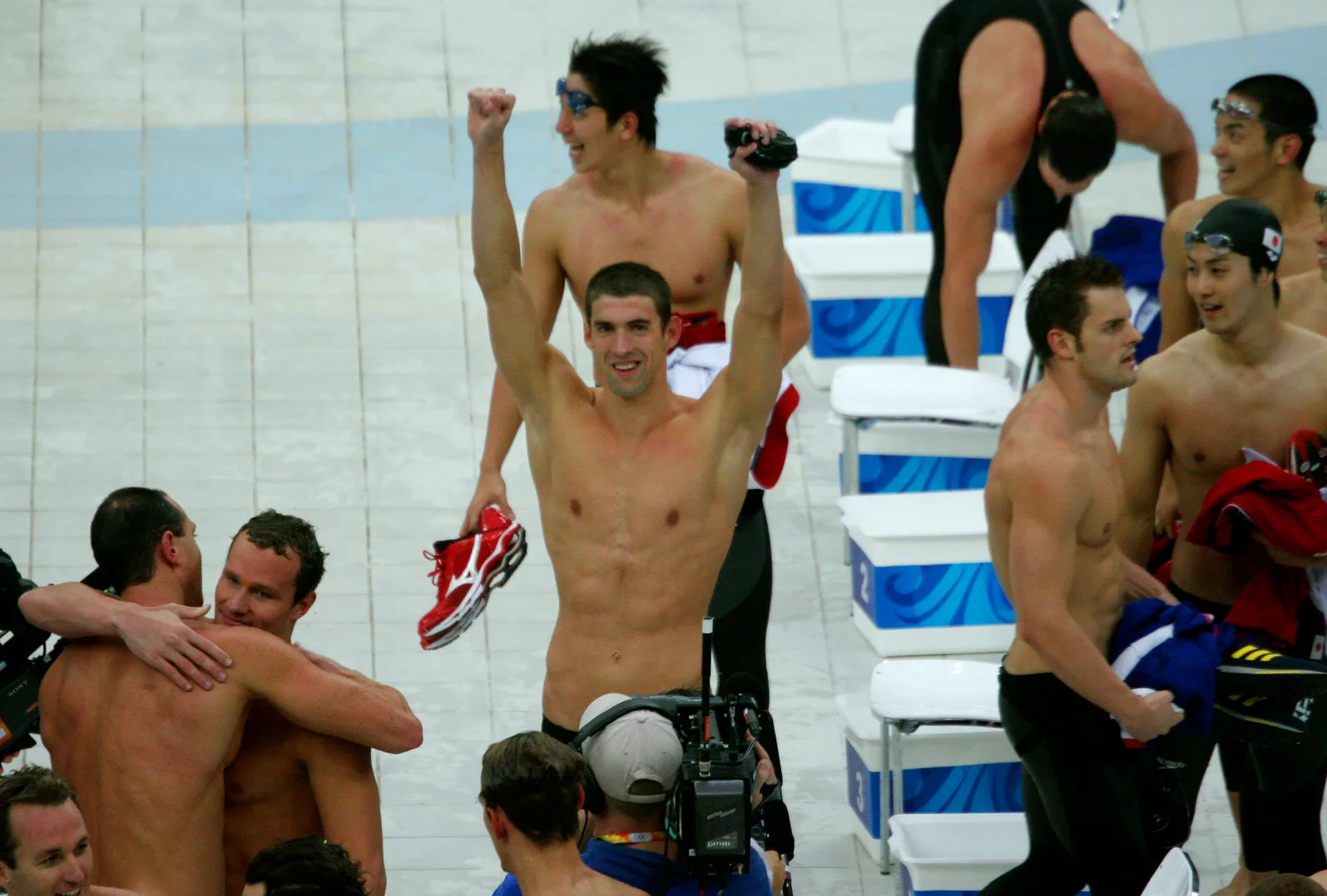 Phelps and US relay teammates celebrate his eighth gold in Beijing, 17 August 2008