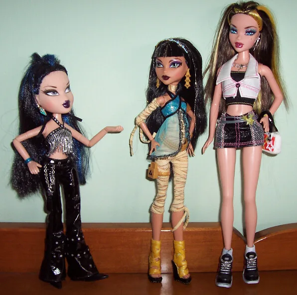 A collector's display of three Monster High dolls