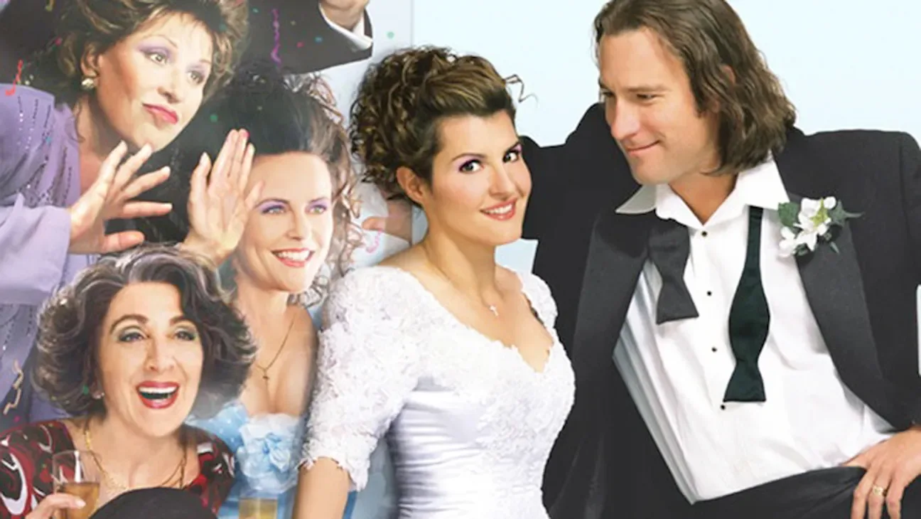 Nia Vardalos and John Corbett with members of the Portokalos family, from the film.