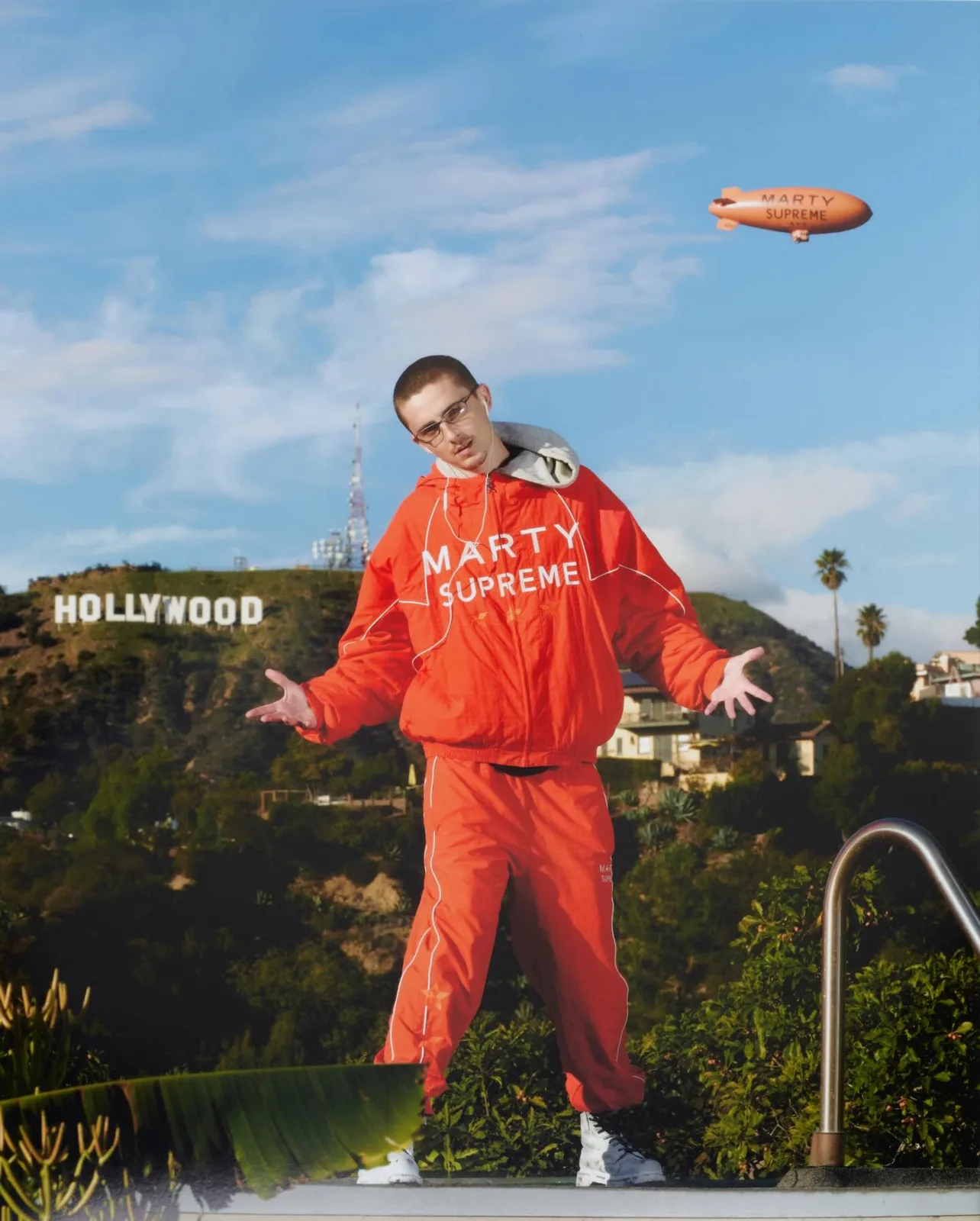 Chalamet wore the orange Marty Supreme windbreaker in an official Nahmias campaign image.