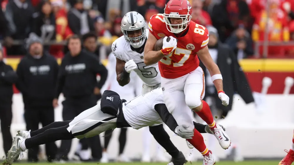 Travis Kelce runs with the ball on Christmas Day