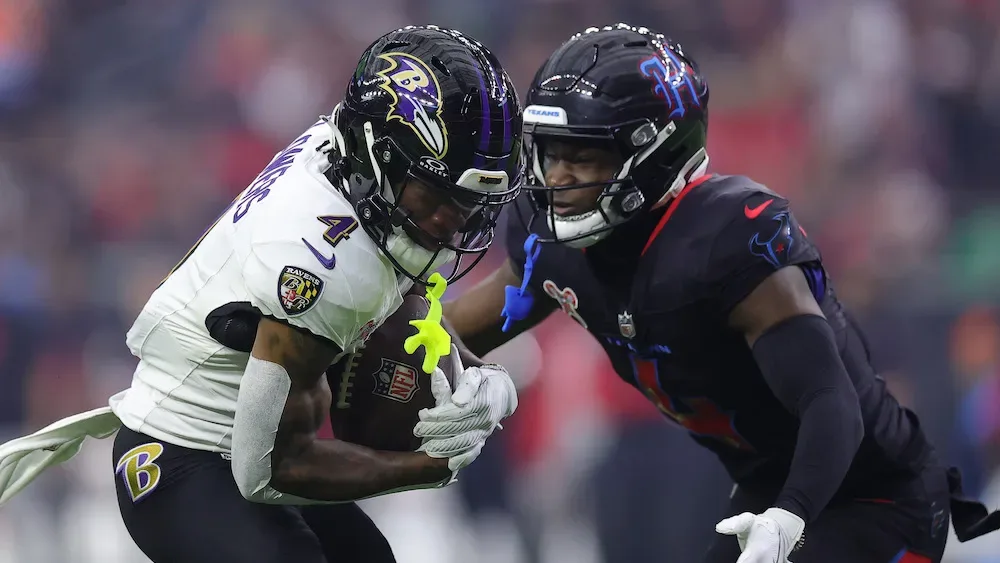 Zay Flowers of the Baltimore Ravens runs with the ball in Houston