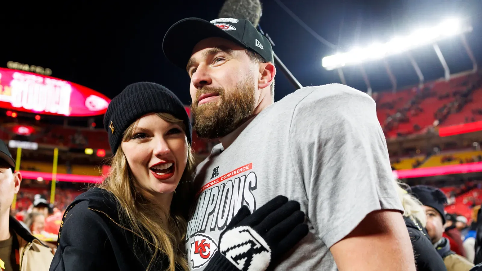 KANSAS CITY, MISSOURI - JANUARY 26: Tight end Travis Kelce #87 of the Kansas City Chiefs celebrates with Taylor Swift after the AFC Championship football game against the Buffalo Bills, at GEHA…