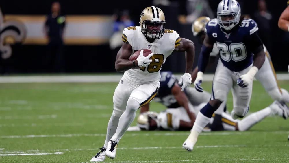 Latavius Murray carries for the Saints in the Nickelodeon wild-card game