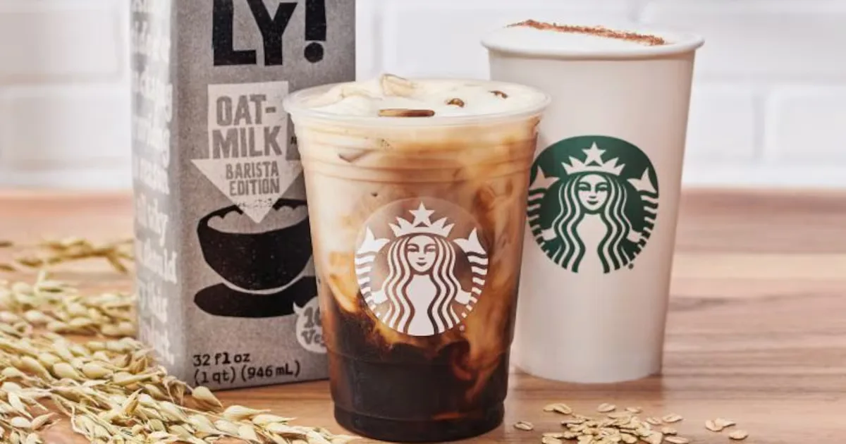Starbucks drinks beside an Oatly carton