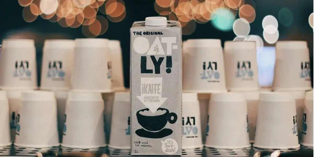 Oatly cartons among coffee cups