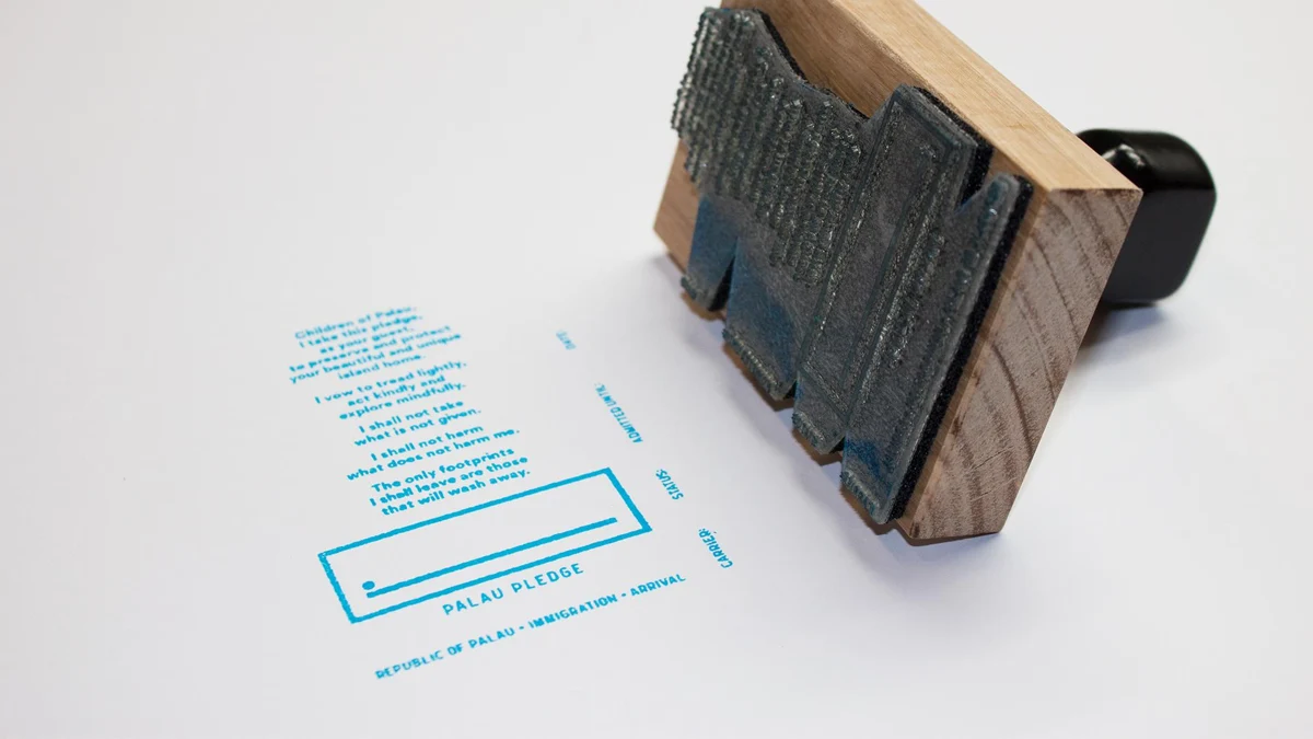 Palau Pledge immigration stamp and its printed environmental promise. Official campaign press image; exact photograph date not stated.