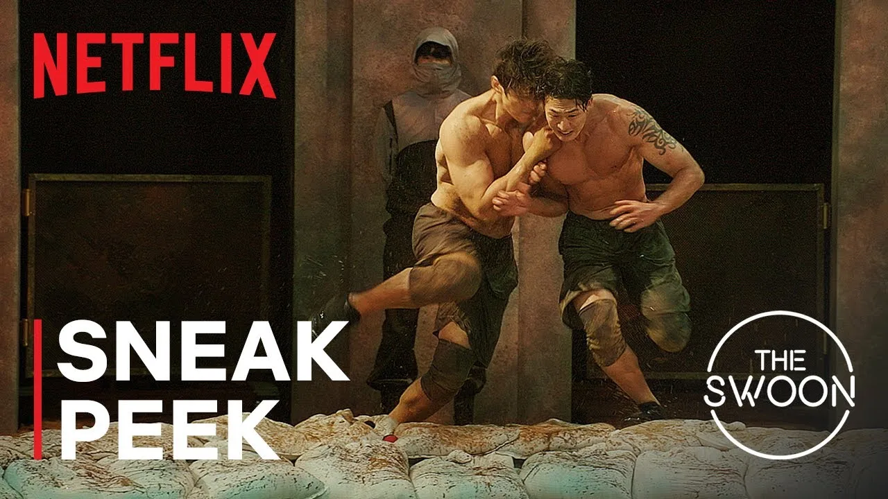 Physical: 100 sneak peek: two contestants grapple in the sand