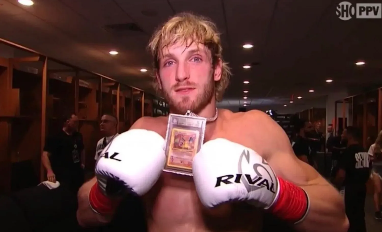 Logan Paul wears a first-edition Pokémon card necklace at the Mayweather fight