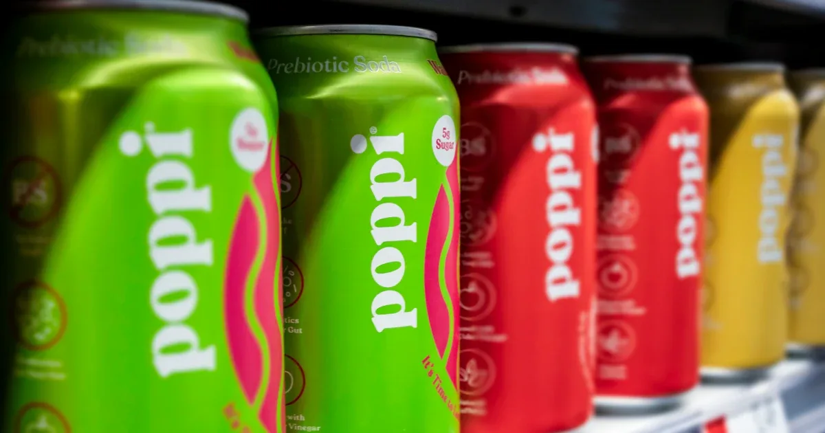 Poppi cans lined up on a shelf