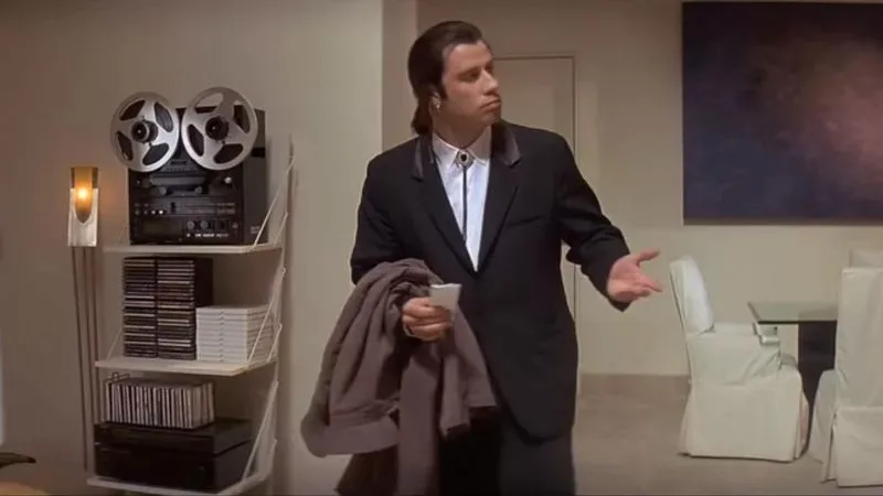 Vincent looks around confused in Mia's house, the frame behind the Confused Travolta meme