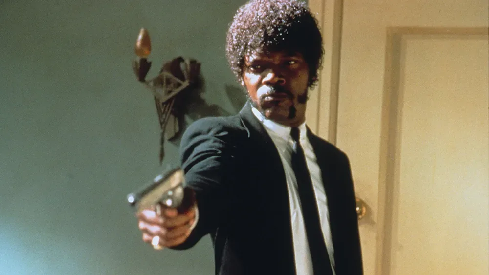Samuel L. Jackson as Jules, gun raised