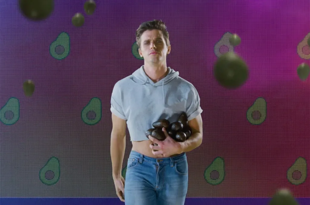 Still from the Queer Eye theme video, with falling avocados