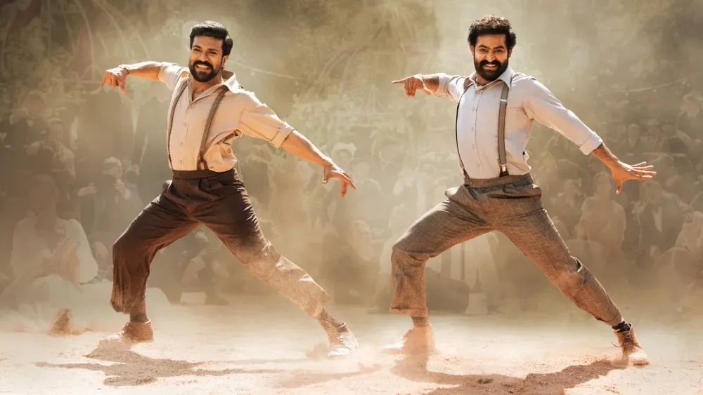 Ram Charan and N. T. Rama Rao Jr. dancing 'Naatu Naatu'.