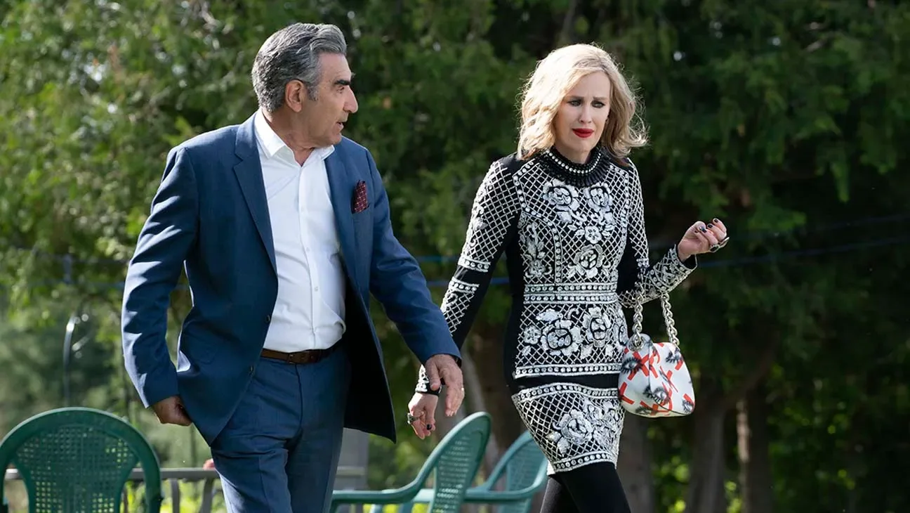 Johnny and Moira Rose walking in a scene from the series.