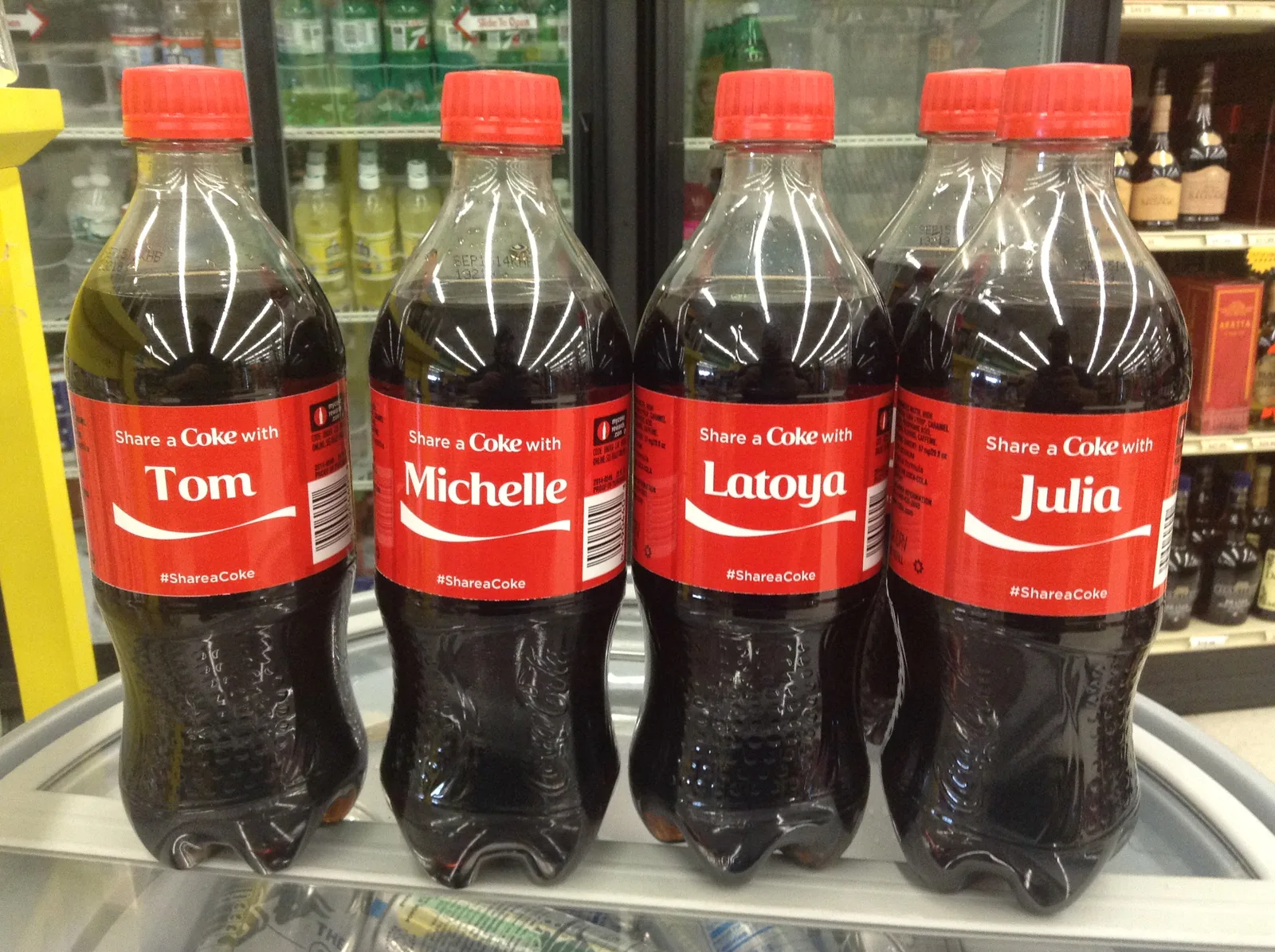 Named Share a Coke bottles photographed in June 2014; CC BY 2.0.