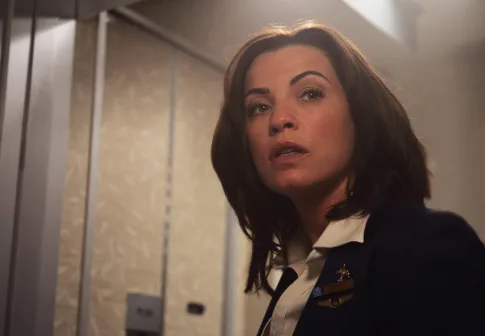 Julianna Margulies as a flight attendant