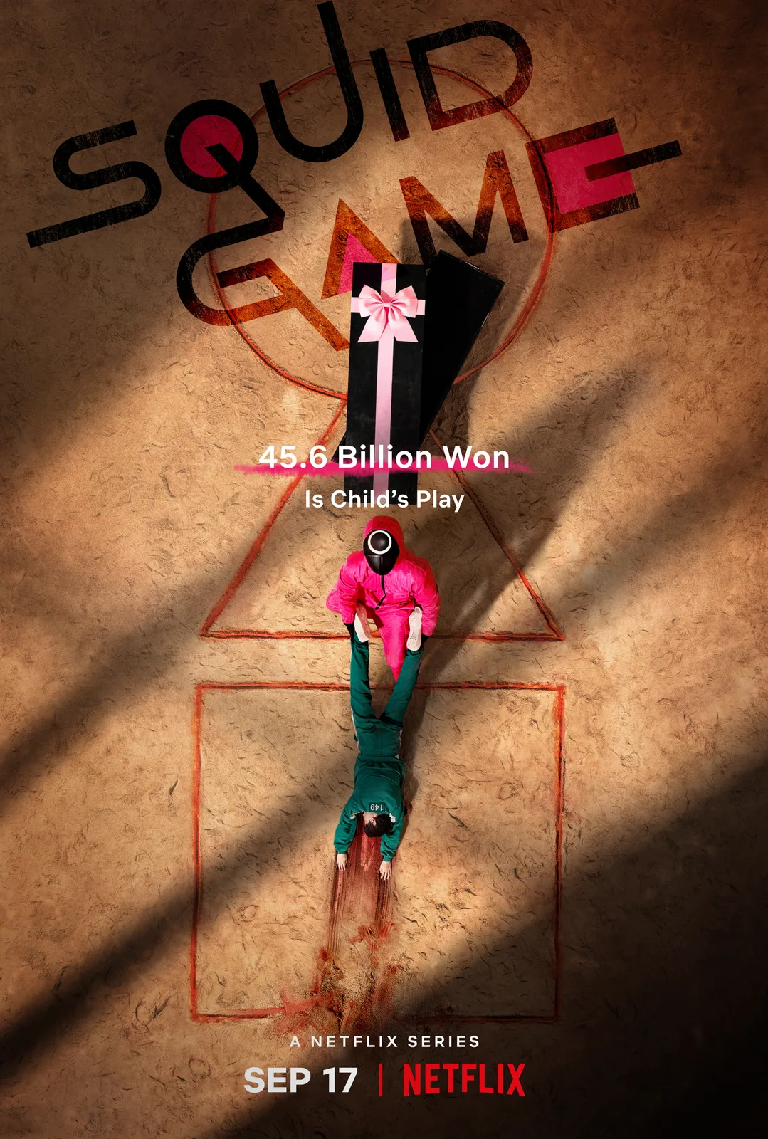 Original 2021 teaser poster showing a pink guard dragging a player beside a gift-wrapped box.