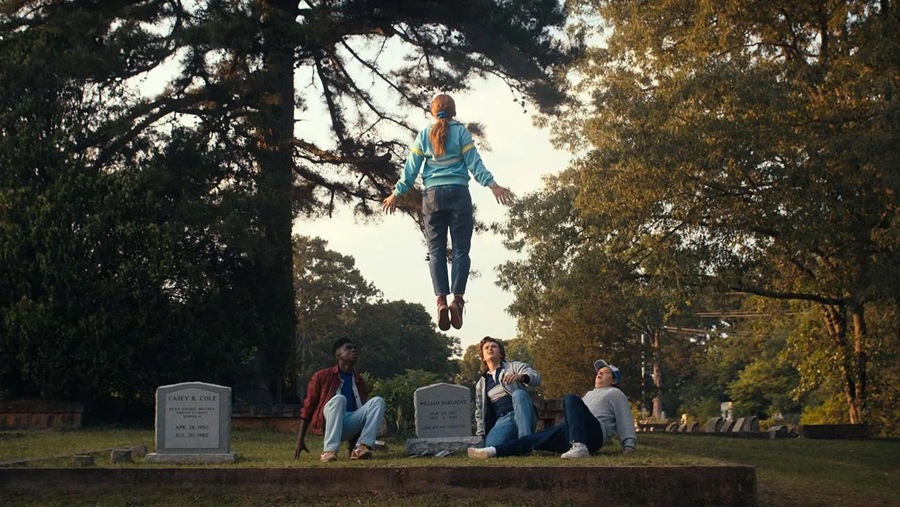 Max floating above a cemetery in the 'Running Up That Hill' scene from season 4.