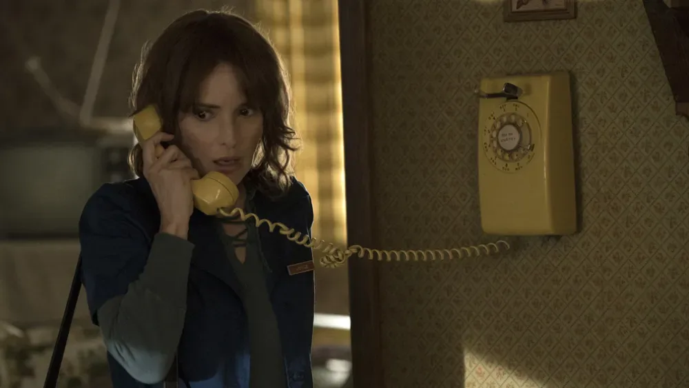 A call on the Byers family's wall phone.