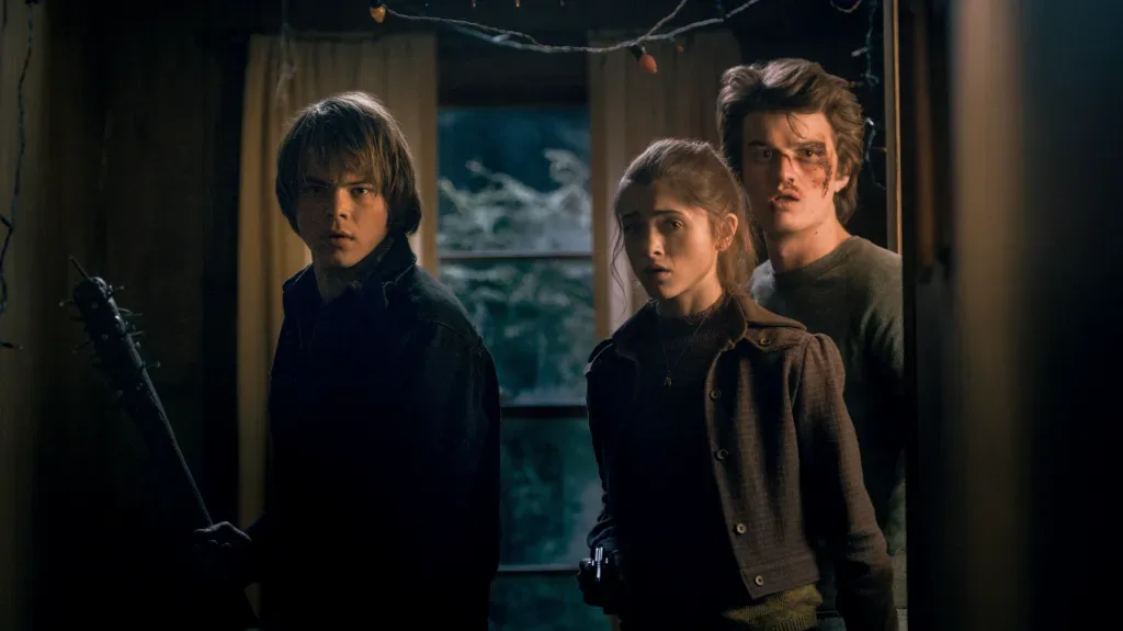 The boys searching the woods with flashlights in the first trailer.