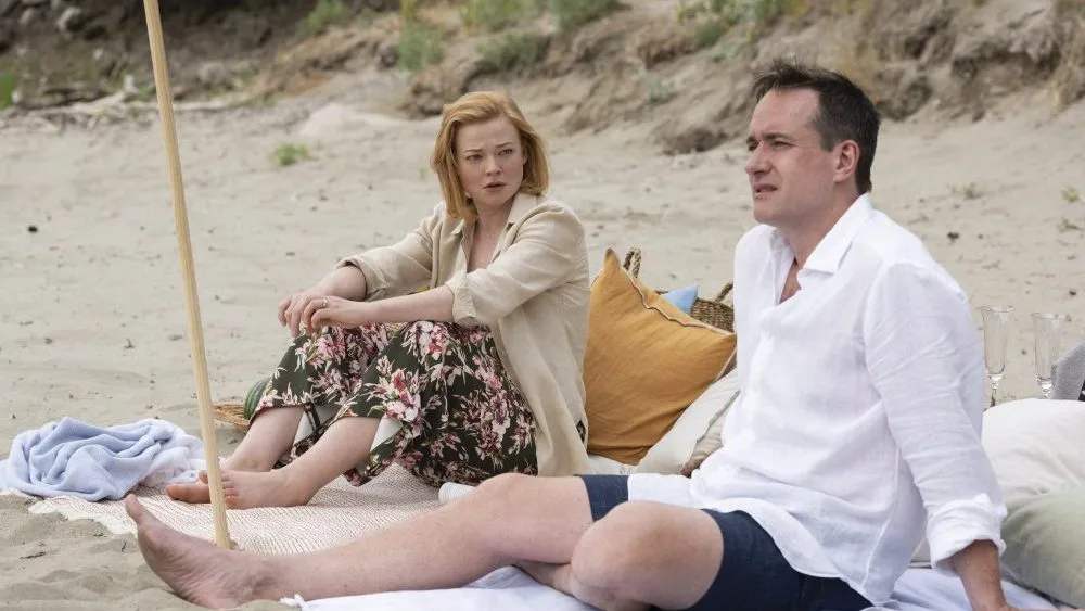 Shiv and Tom on a beach in Succession