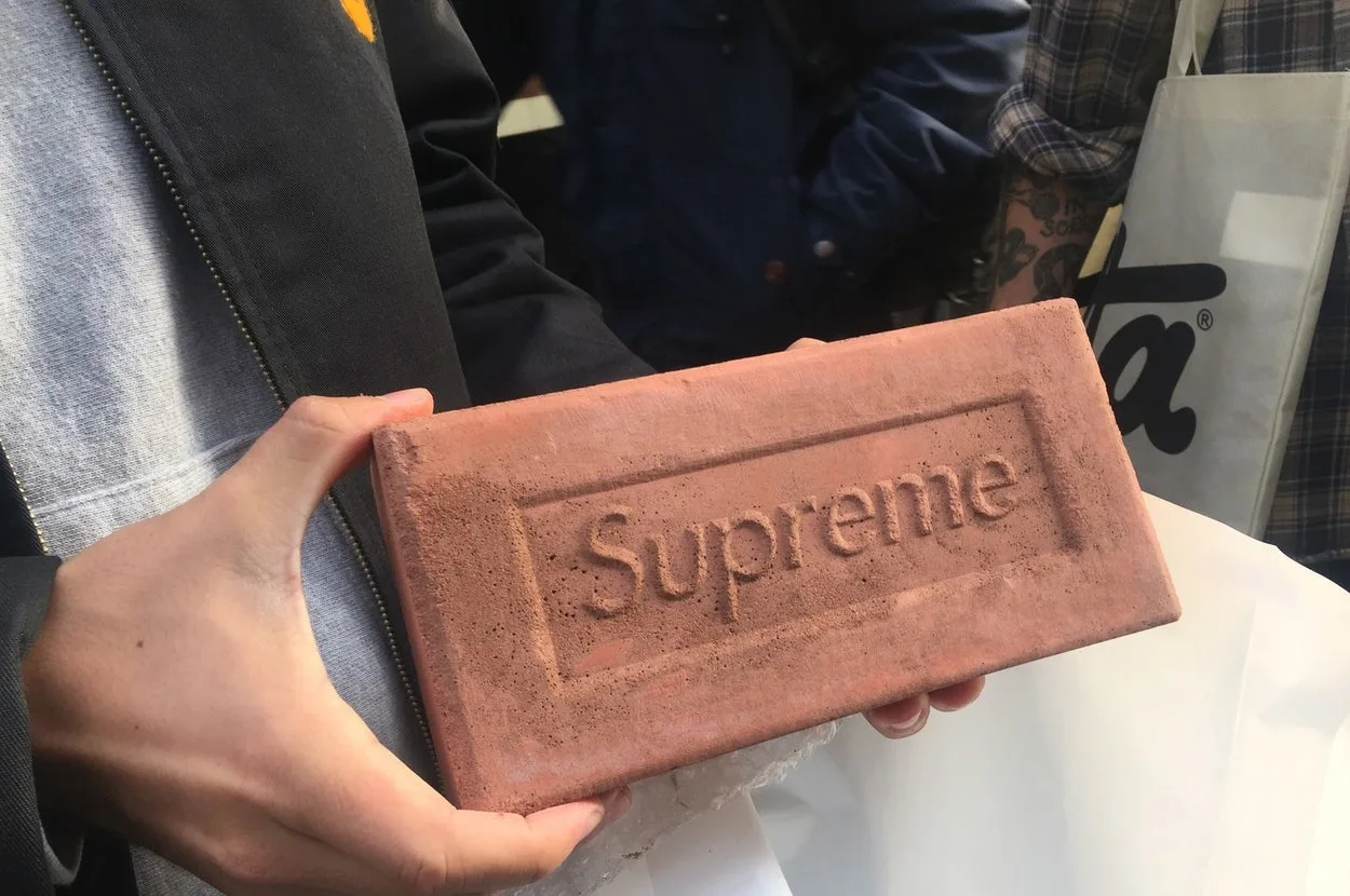 A buyer holding a Supreme brick