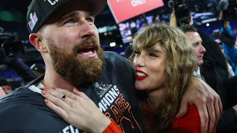 Kelce and Swift embrace on the field