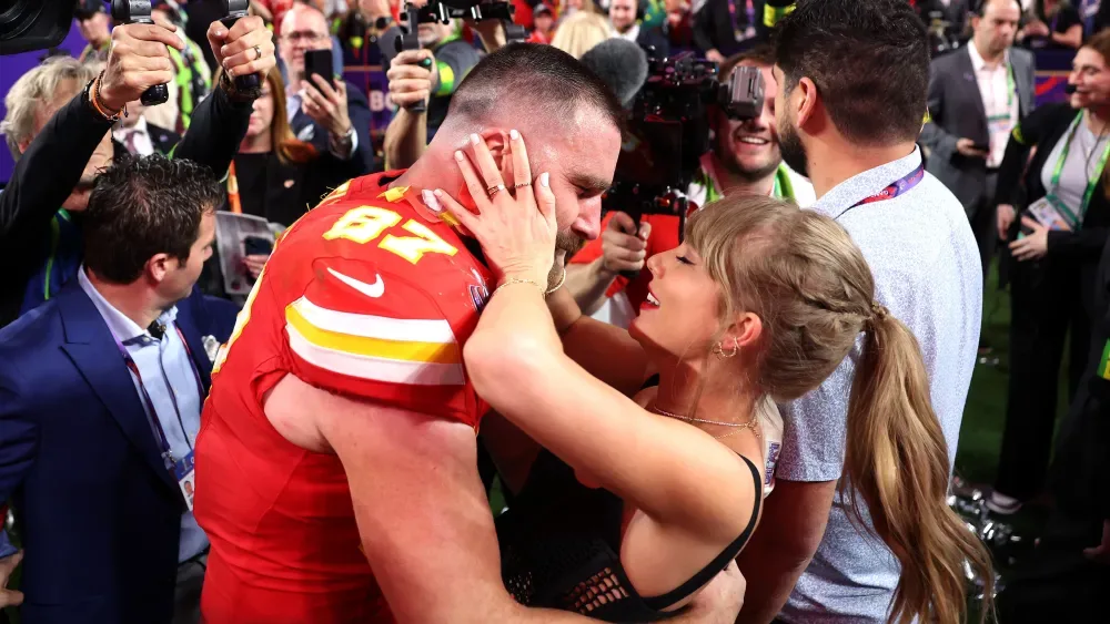 Swift and Kelce kiss after the Super Bowl LVIII win
