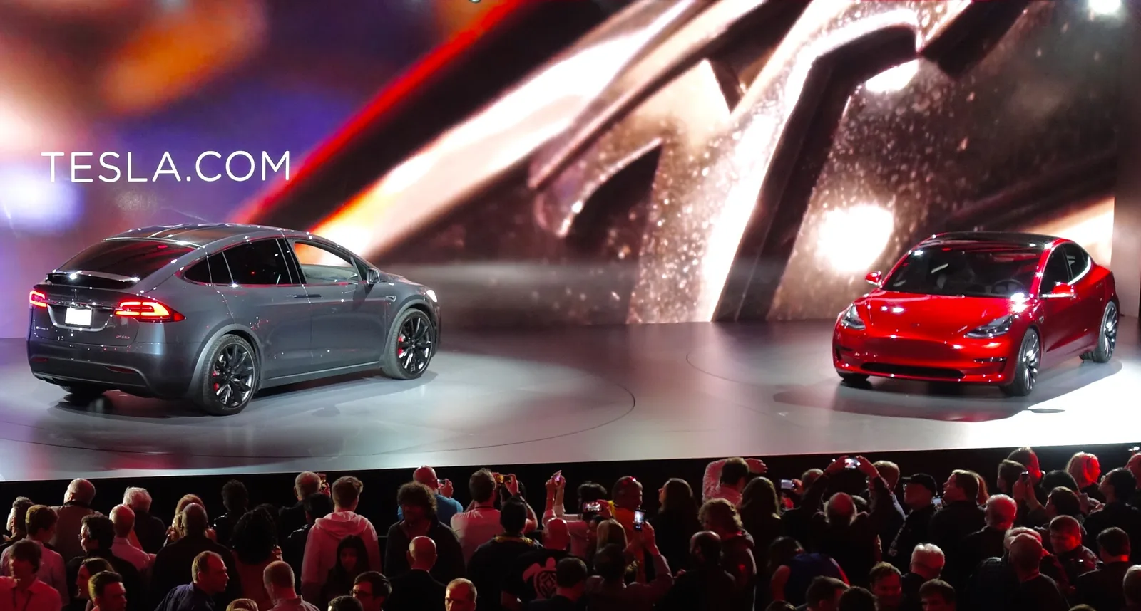 The Model 3 prototype at the March 31 reveal, beside a Model X. CC BY 2.0.
