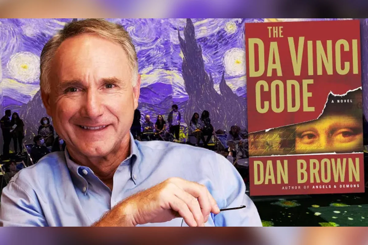Dan Brown with art for The Da Vinci Code immersive experience