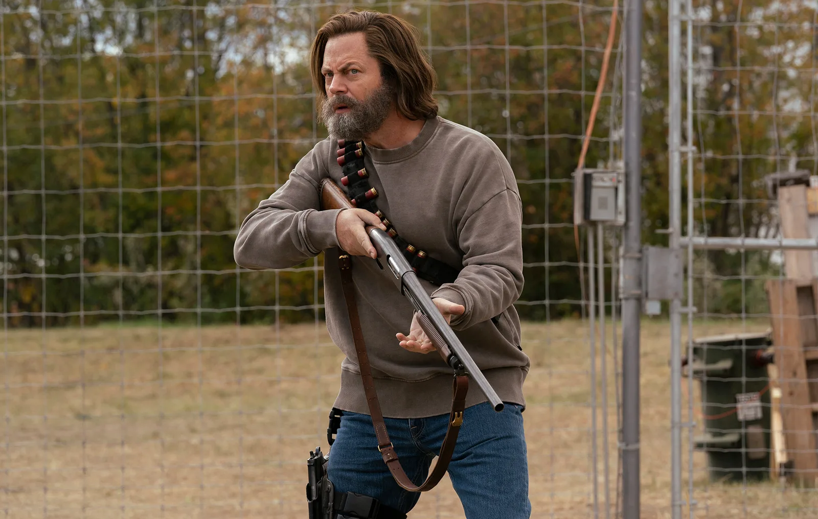 Nick Offerman as Bill guarding his fence.