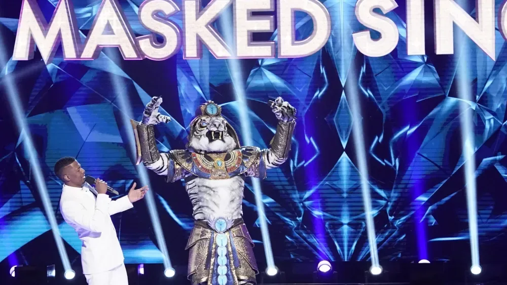 MASKED SINGER: L-R: Host Nick Cannon and the White Tiger in the Season Three premiere of THE MASKED SINGER airing Sunday, Feb. 2 (10:30-11:40 PM ET/7:30-8:40 PM PT live to all time zones) on FOX,…
