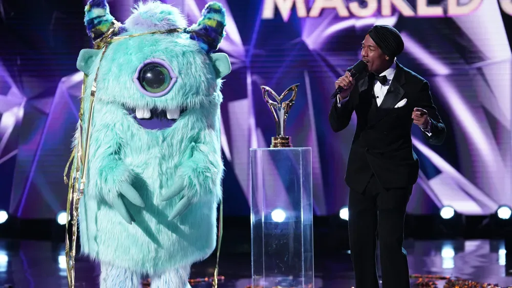 THE MASKED SINGER: L-R: Monster (T-Pain) and host Nick Cannon in the special two-hour “Road to the Finals / Season Finale: The Final Mask is Lifted” season finale episode of THE MASKED SINGER airing…