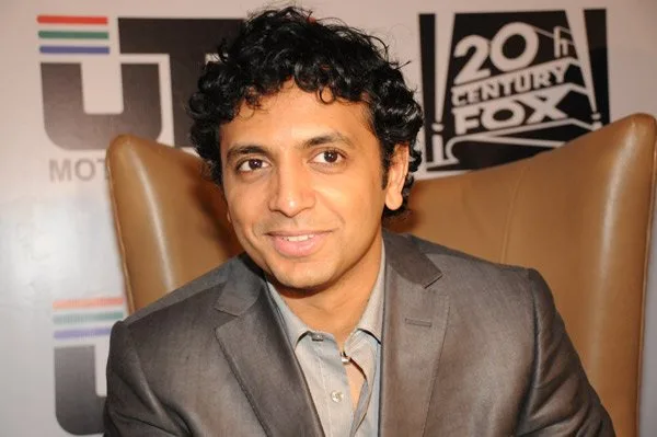 M. Night Shyamalan at a 2008 press conference for The Happening, not a Sixth Sense premiere photo.