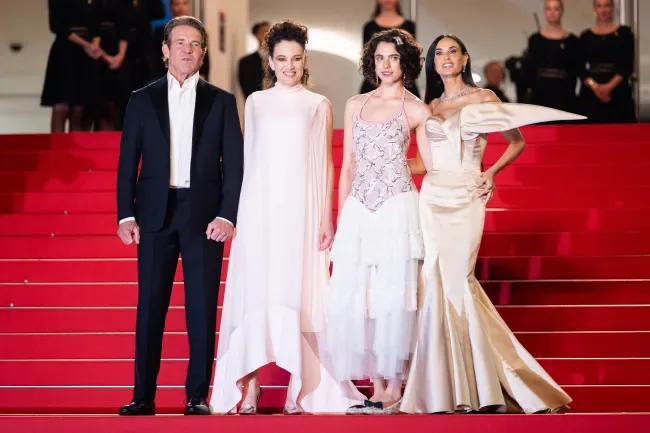 CANNES, FRANCE - MAY 19: (L-R) Dennis Quaid, Coralie Fargeat, Margaret Qualley and Demi Moore attend the "The Substance" Red Carpet at the 77th annual Cannes Film Festival at Palais des Festivals on…