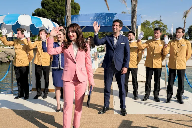 Hotel staff welcome guests in season 2