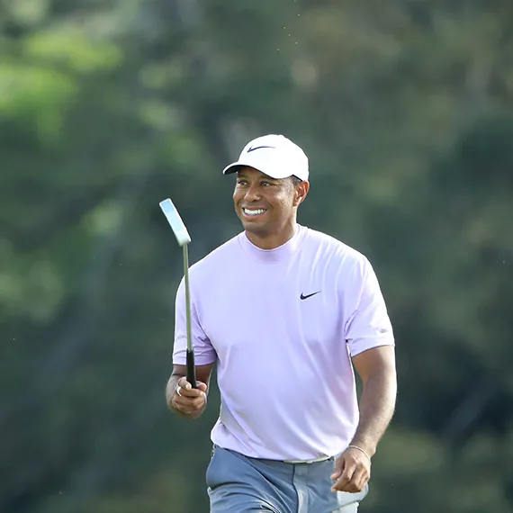 Woods smiles during his Saturday 67 at Augusta